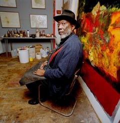 Painter Frank Bowling in his studio, photographed by Eamonn McCabe