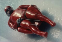 Olympic luge athlete racing down the track, photographed by Eamonn McCabe