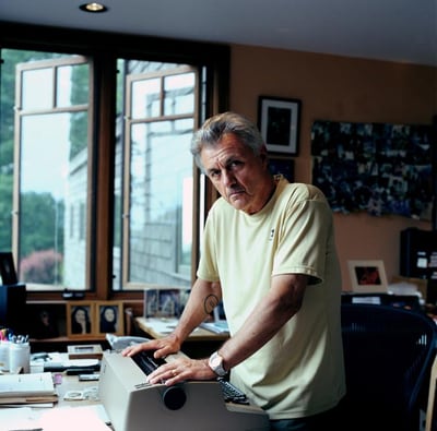 Portrait of novelist John Irving at his typewriter by Eamonn McCabe